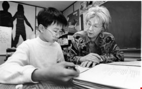 Elementary student with teacher, October 1, 1995 thumbnail