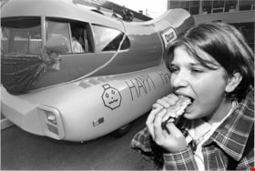 A girl eating a hot dog, November, 1995 thumbnail