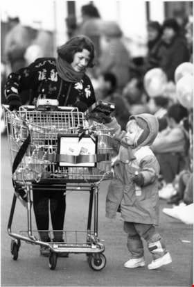 Woman and child collecting donations, December, 1995 thumbnail