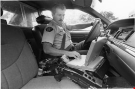 Royal Canadian Mounted Police Officer in his cruiser, January 3, 1996 thumbnail