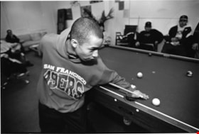 Boy playing pool, February 11, 1996 thumbnail