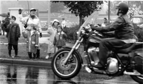 Family waving to motorcycle riders, October 30, 1996 thumbnail