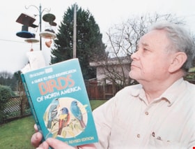 Ron Johnstone with bird guide, [2000] thumbnail