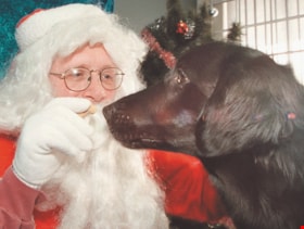 Santa with a dog at PAWS Centre, [2000] thumbnail