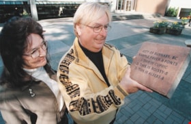 Celeste Redman and Gary Begin with Citizens' Plaza paver, [2001] thumbnail
