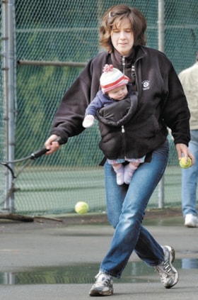 Corrie Guraliuk playing tennis with baby, [2003] thumbnail