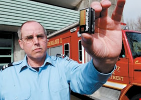 Fire fighter Jim Dixon with battery, [2003] thumbnail