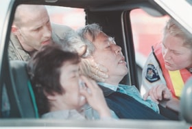 Ambulance workers at a car accident, [2000] thumbnail