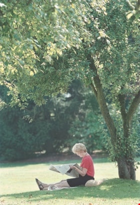 Woman reading under a tree, [2000] thumbnail