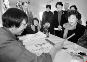 Sheila Chow demonstrating brush painting, [1999] thumbnail