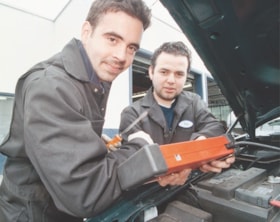 Mechanics in a garage, [1999] thumbnail