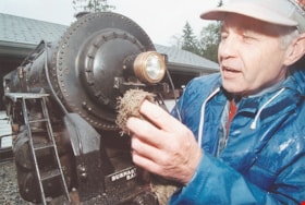 Polishing a model engine at Burnaby Central Railway, [1999] thumbnail