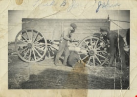 Repairing a wooden wagon wheel, [193-] thumbnail