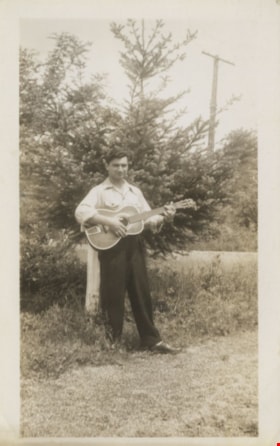 John Ivan Yanko playing a guitar, 1949 thumbnail