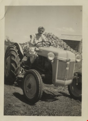 Lillian Yanko steering a Fordson tractor, July 1949 thumbnail