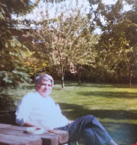 Tony Fabian relaxing at a picnic table, [1970]. Item no. 549-026. thumbnail