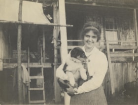 Unidentified woman holding a dog, [between 1910 and 1920] thumbnail