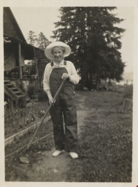 Unidentifed woman holding a garden hoe, [1924] thumbnail