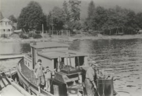 Unidentified women and boy on a boat, 1925 thumbnail