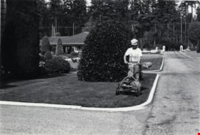 Municipal Worker Mowing Lawn, September 8, 1976 thumbnail