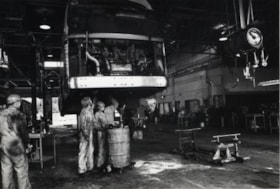 Mechanics working on bus, October, 1976 thumbnail