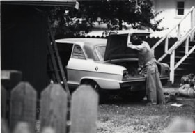 Man working on car, September 12, 1976 thumbnail