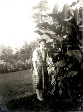 Betty with cannas plant,  [195-] (date of original), copied 2014 thumbnail