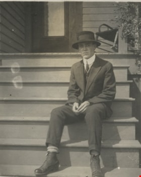 Young man sitting on the steps, [190-] thumbnail