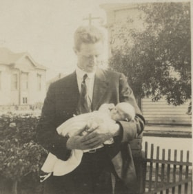 Young man holding a baby, September 17, 1917 thumbnail