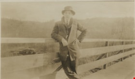 Young man leaning against a railing, [190-] thumbnail