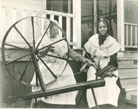Mrs. Coulter-White and Mrs. Annie Dale at a spinning wheel, [189-] thumbnail