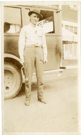 Standing beside the bus, [between 1926 and 1930] thumbnail