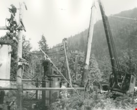 Erecting power line poles, [194-?] (date of original), copied 1976 thumbnail