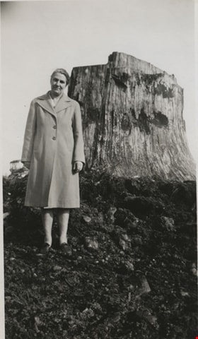 Ada Bingham by a tree stump, [1948] thumbnail