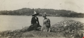 Two women seated by the water, [190-] thumbnail