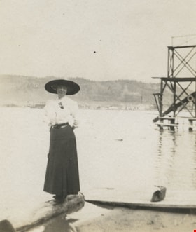 Woman standing at the water's edge, [190-] thumbnail