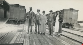 Standing by railway tracks, [192-?] thumbnail