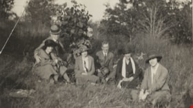Men and women sitting on the grass, [192-?] thumbnail
