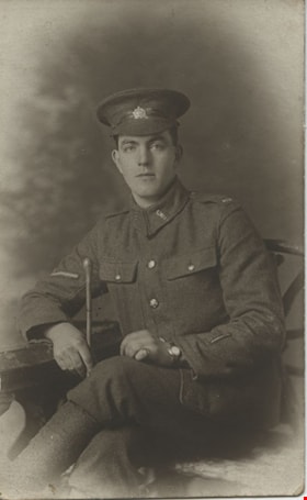 Seated man in a military uniform, [between 1914 and 1918] thumbnail