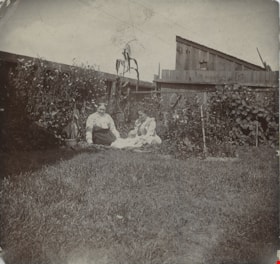 Women and a baby in the garden, [between 1900 and 1905] thumbnail