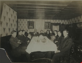 Seated at the table, [between 1910 and 1936] thumbnail