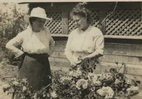 Two women in a garden, [between 1912 and 1925] thumbnail