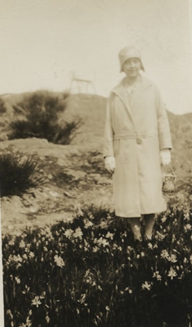 Woman standing on a field at Buena Vista, [between 1912 and 1925] thumbnail