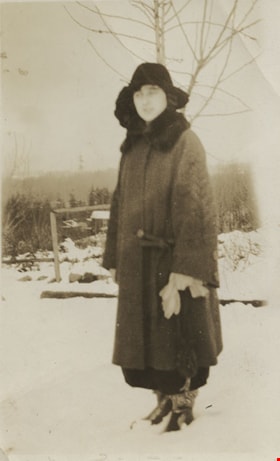 Wearing snow shoes and a velvet dress, [between 1912 and 1925] thumbnail