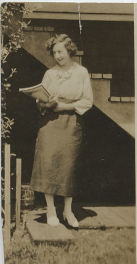 Woman with books, [192-?] thumbnail