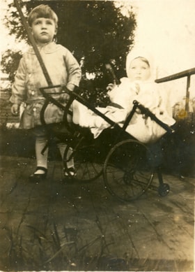 Boy with baby in a cart, [between 1910 and 1920] thumbnail