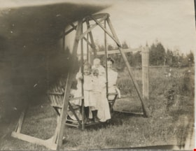 Mackenzie family on lawn swing, [1907 or 1908] thumbnail