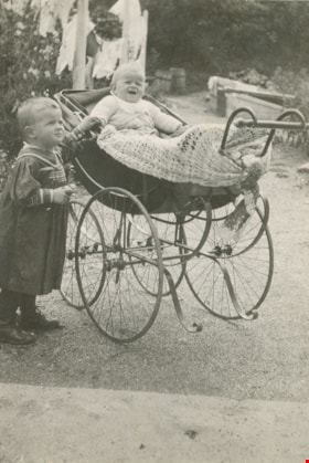 Boy with baby in a carriage, August 1914 thumbnail