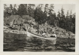 Row boat by rocky shore, May 1938 thumbnail