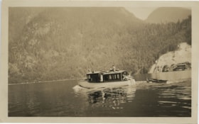 People in a boat towing a dinghy, [between 1910 and 1925] thumbnail